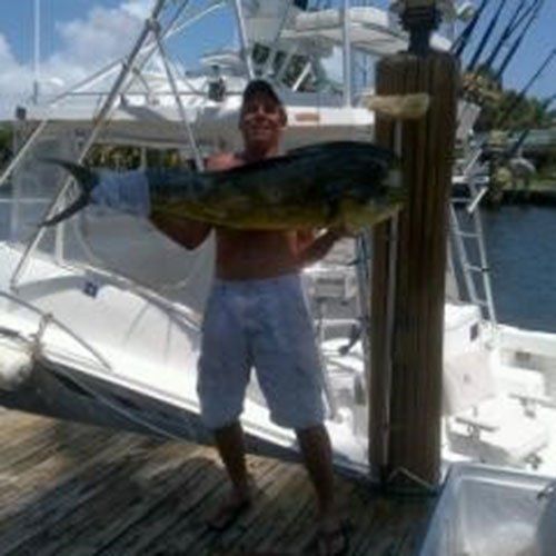 Man Holding a Big Fish — Dania FL — Ironclad Welding