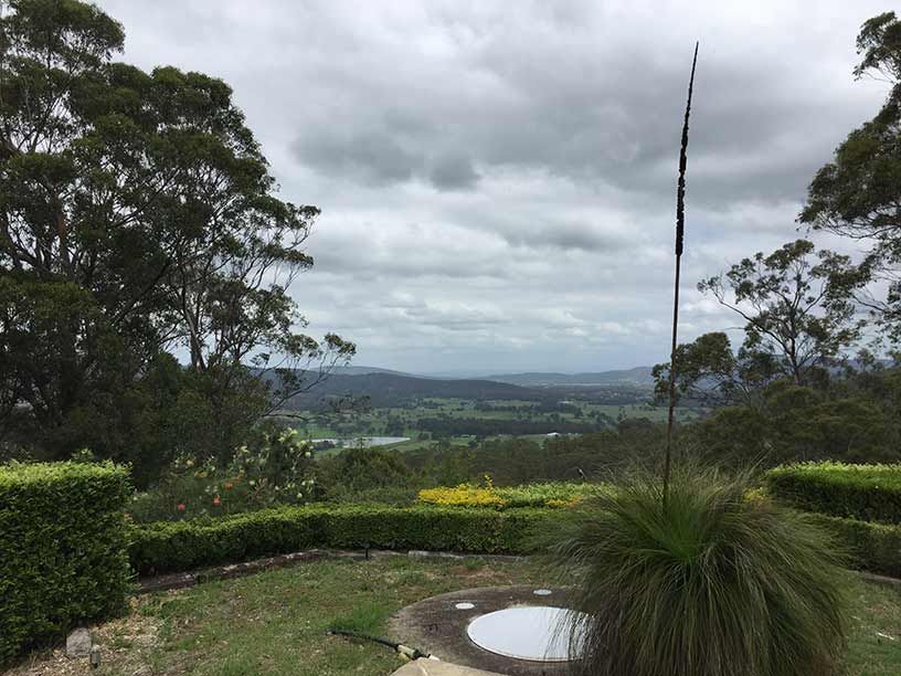 A View of a Valley With Trees and Bushes in the Foreground — All Systems Wastewater Maintenance In Newcastle, NSW