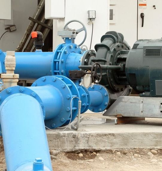 A Bunch of Blue Pipes Are Lined Up Next to Each Other — All Systems Wastewater Maintenance In Mid North Coast, NSW
