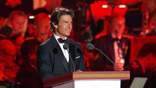 Tom Cruise presenting on stage at Windsor for the Queen's Platinum Jubilee in 2022