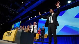 First Minister Humza Youssef takes the applause at the 2023 SNP annual conference in Aberdeen