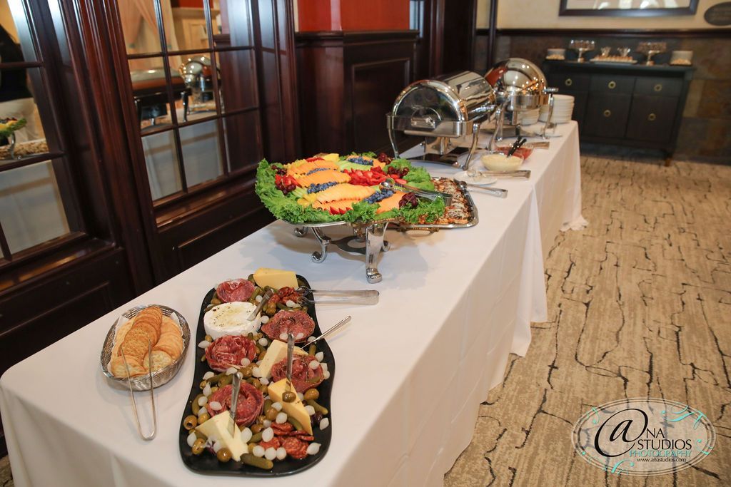 A buffet table with a variety of food on it