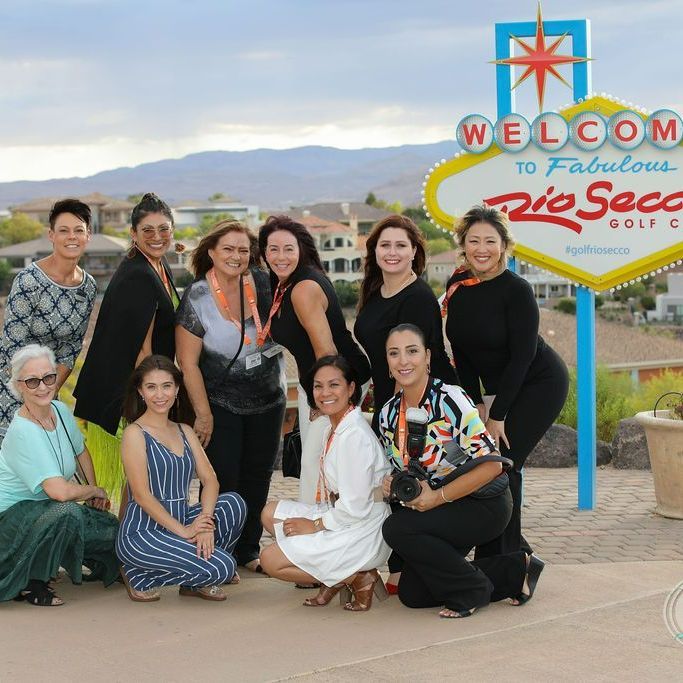 Vegas Wedding Chamber event attendees pose in front of Vegas sign on site at Rio Secco Wedding Venue