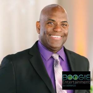 A man in a suit and tie is smiling for the camera