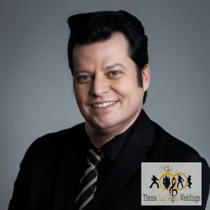 A man in a suit and tie is smiling for the camera.