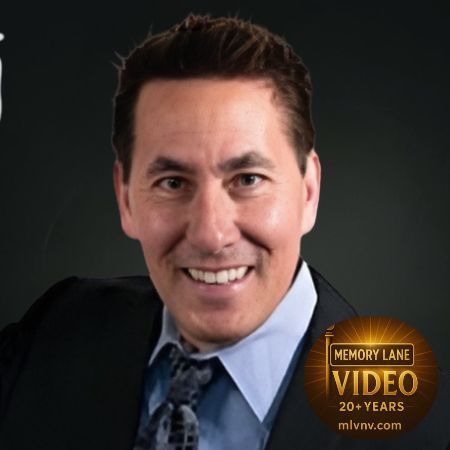 Man in suit smiling, Memory Lane Video logo in corner.