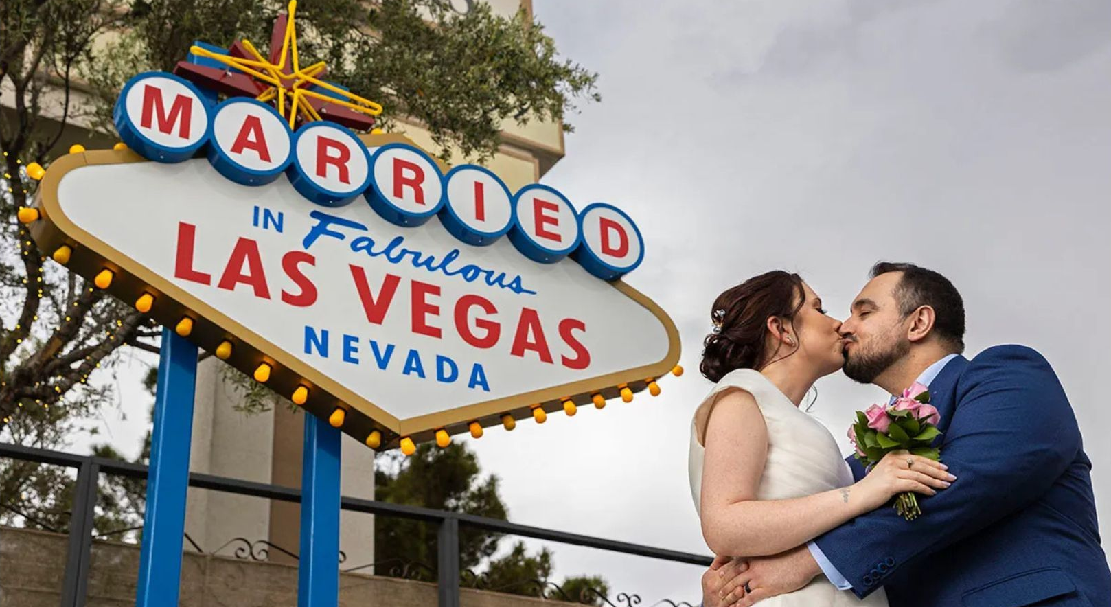 Couple kissing in front of the 