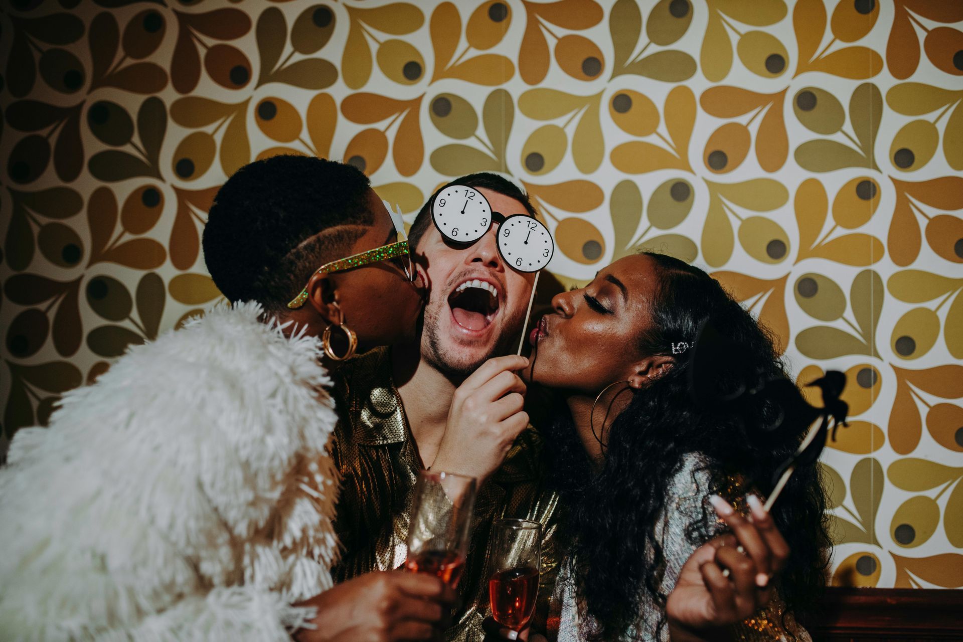 guests taking pictures in photo booth