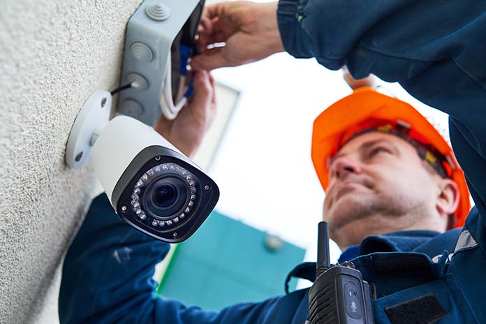 A professional installing CCTV at a home in Tamworth
