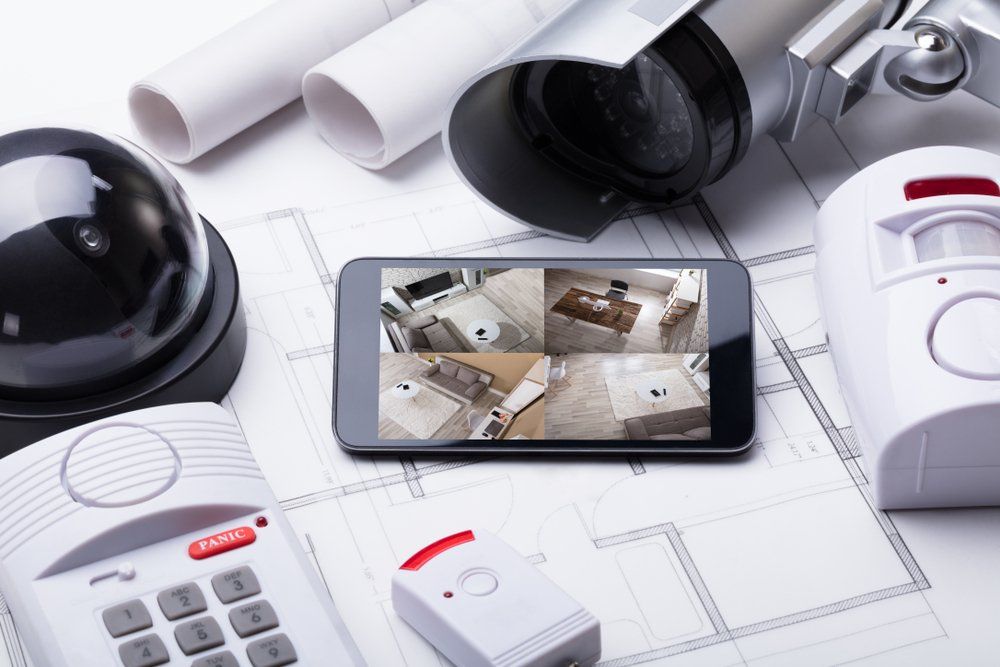 Mobilephone With Security Equipment — Quality Security Systems in Coffs Harbour in NSW