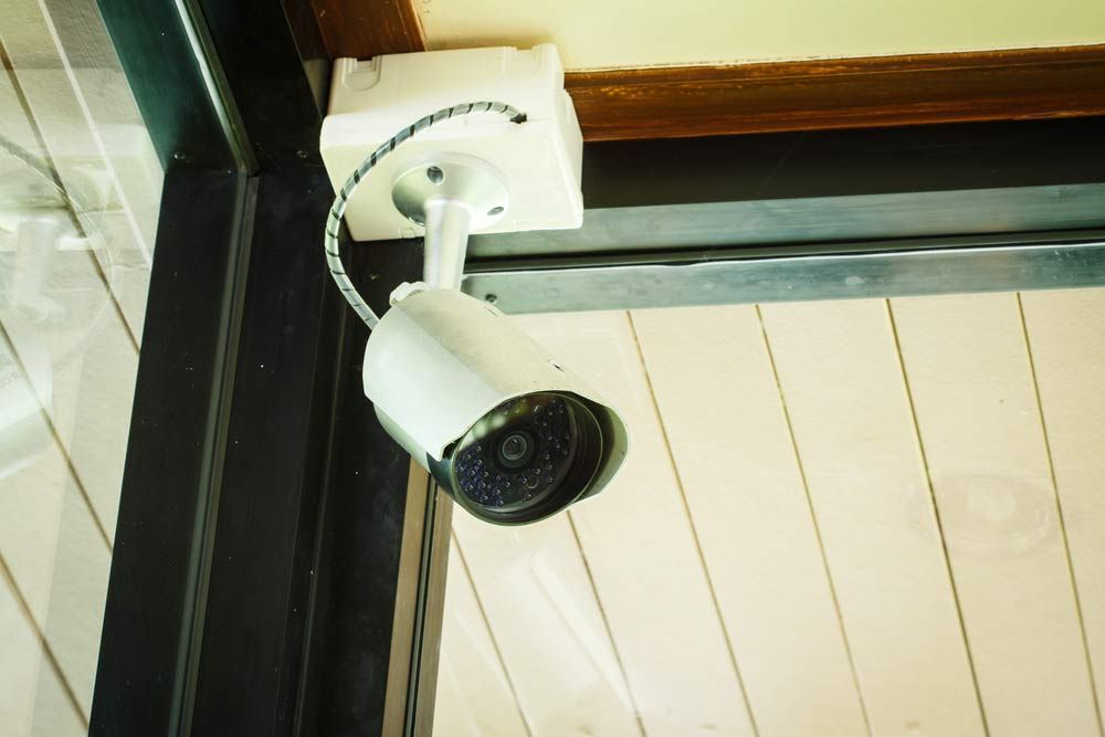 White CCTV Camera On The Wall — Advanced Security Group in Tamworth, NSW