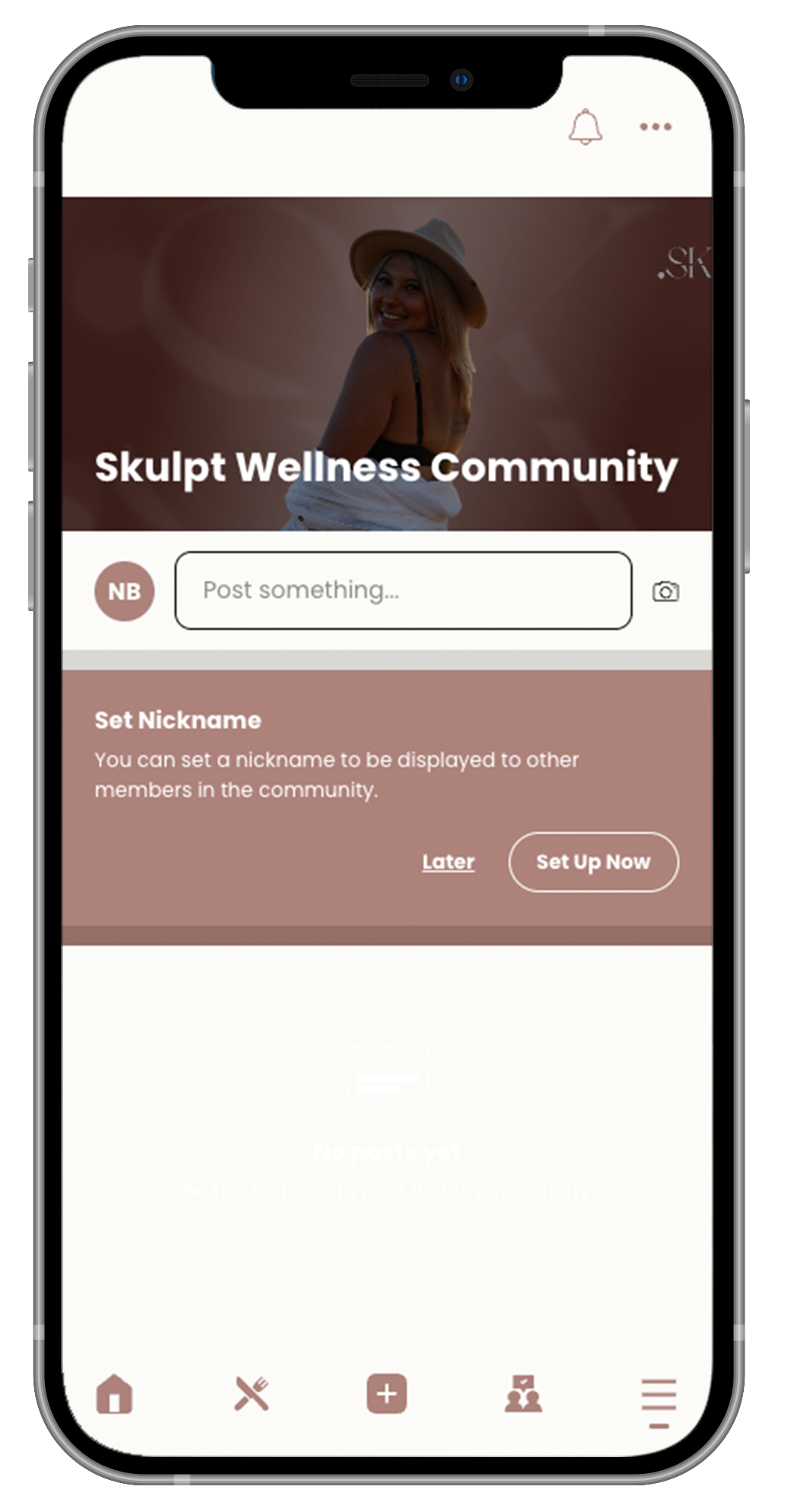 A cell phone with a skullt wellness community app on it.