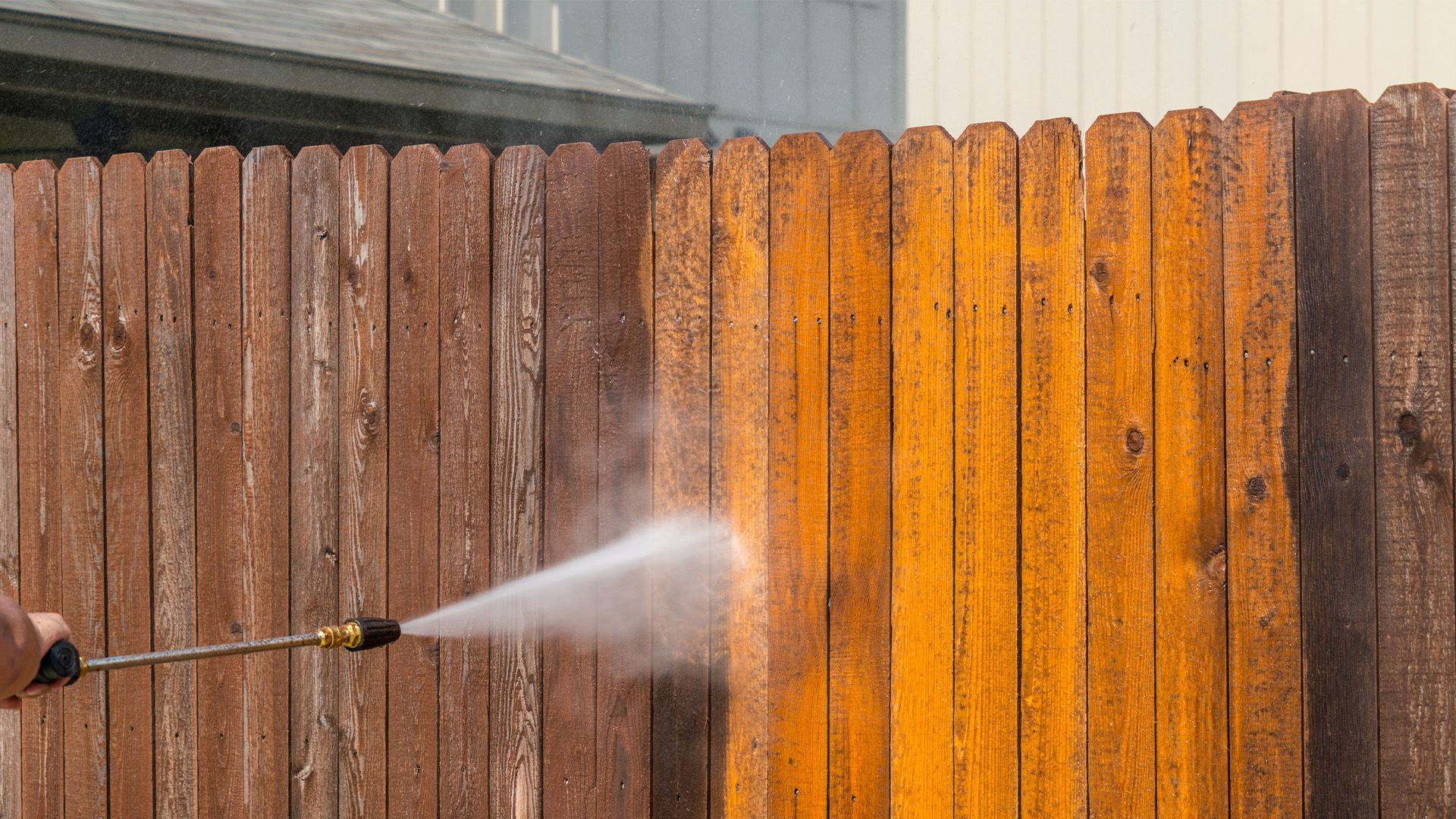 cleaning fence using pressure washer