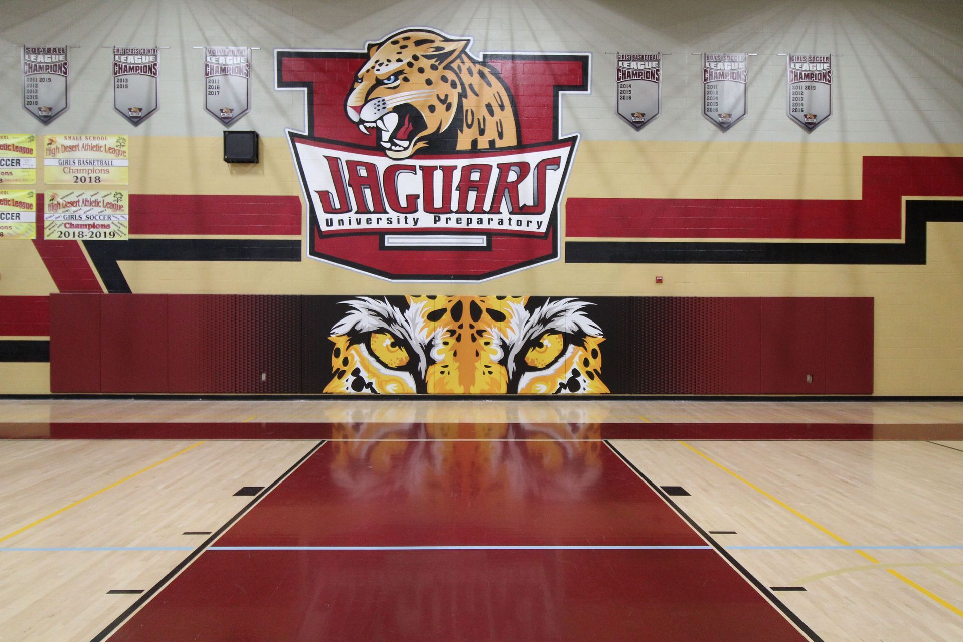 A gym with a jaguars logo on the wall