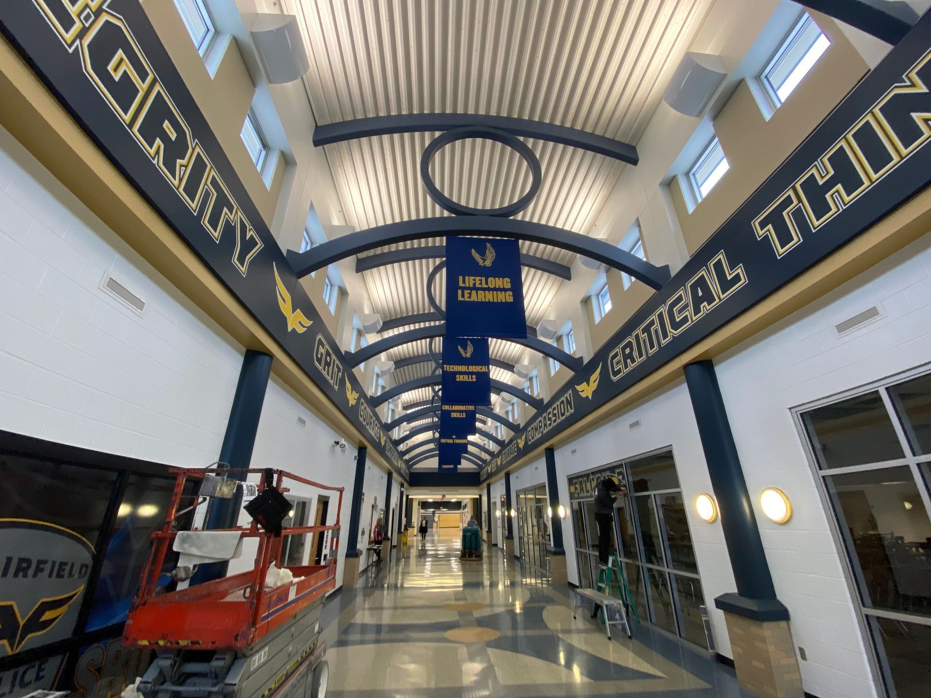 A long hallway with a sign that says ' jordan high school ' on it