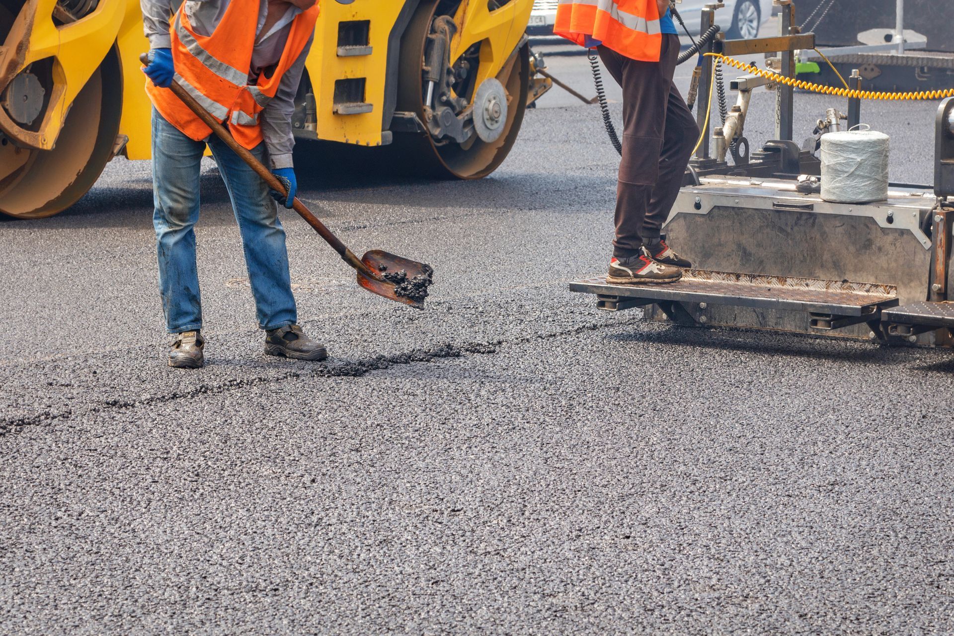 asphalt workers paving the street asphalt workers paving the street
