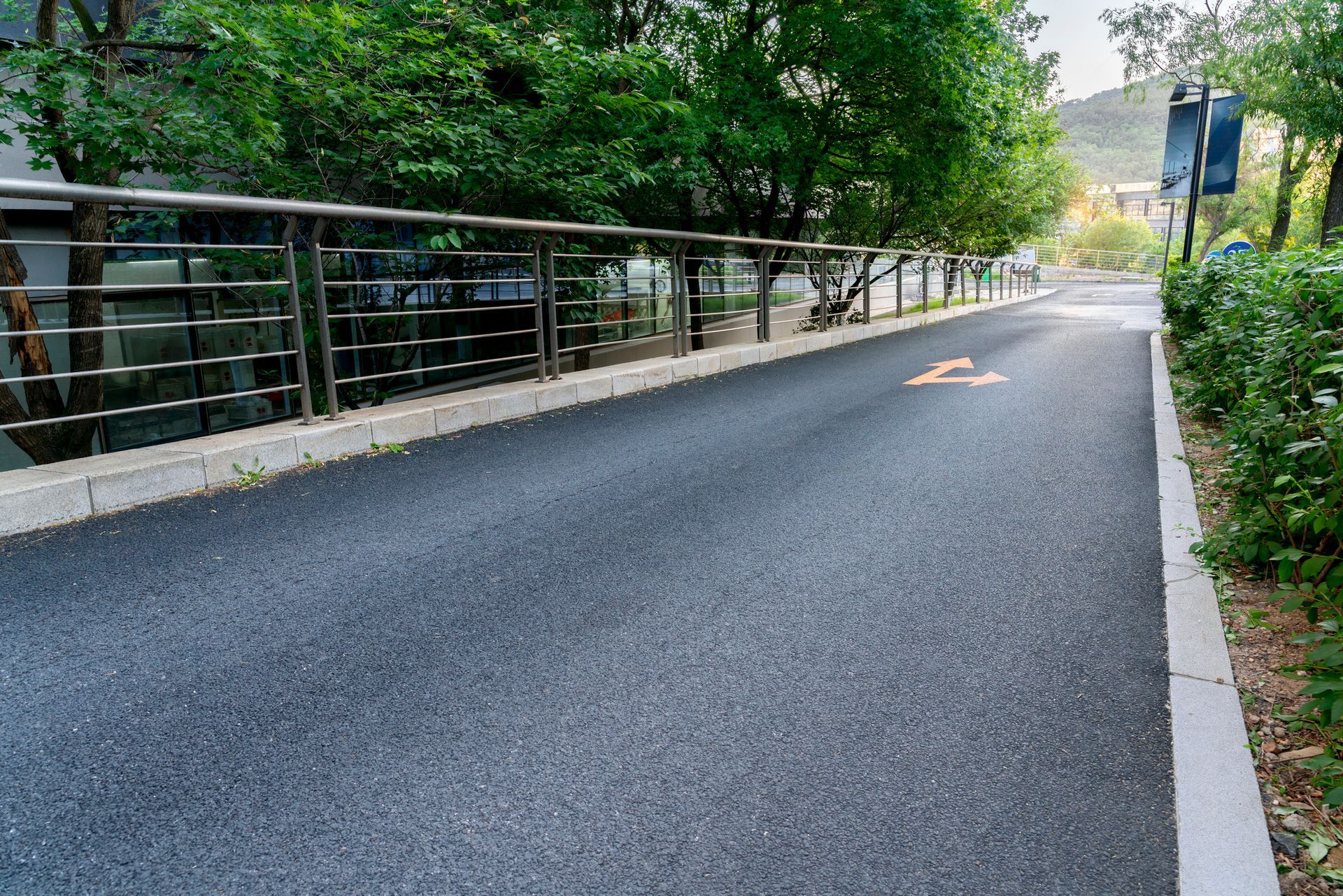 A bicycle lane is painted on the side of a road. A bicycle lane is painted on the side of a road.