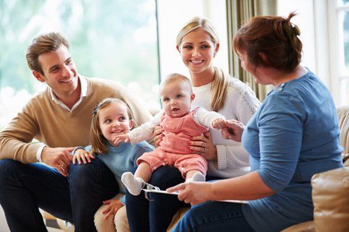 Sexual Abuse Victims — Counselor Talking to Family with Young Baby in Fresno, CA Sexual Abuse Victims — Counselor Talking to Family with Young Baby in Fresno, CA