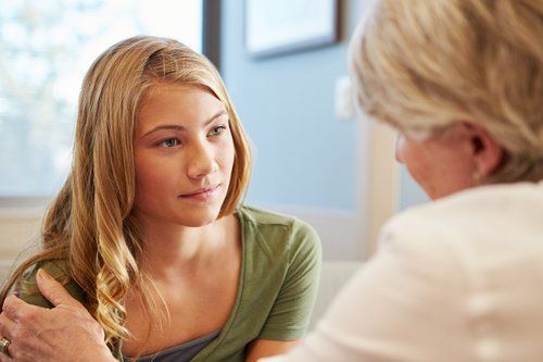 Child Counseling Near Me — Doctor Treating Teenage Girl Suffering From Trauma in Fresno, CA