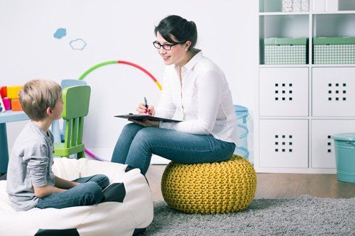 Family Counseling — Therapist Talking To A Boy in Fresno, CA