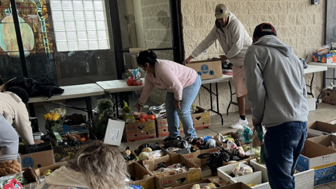 Volunteers rescuing food.