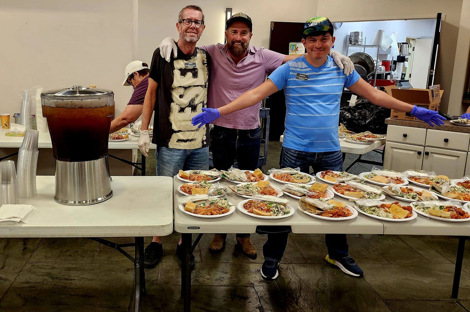 Volunteers making lunches for icare