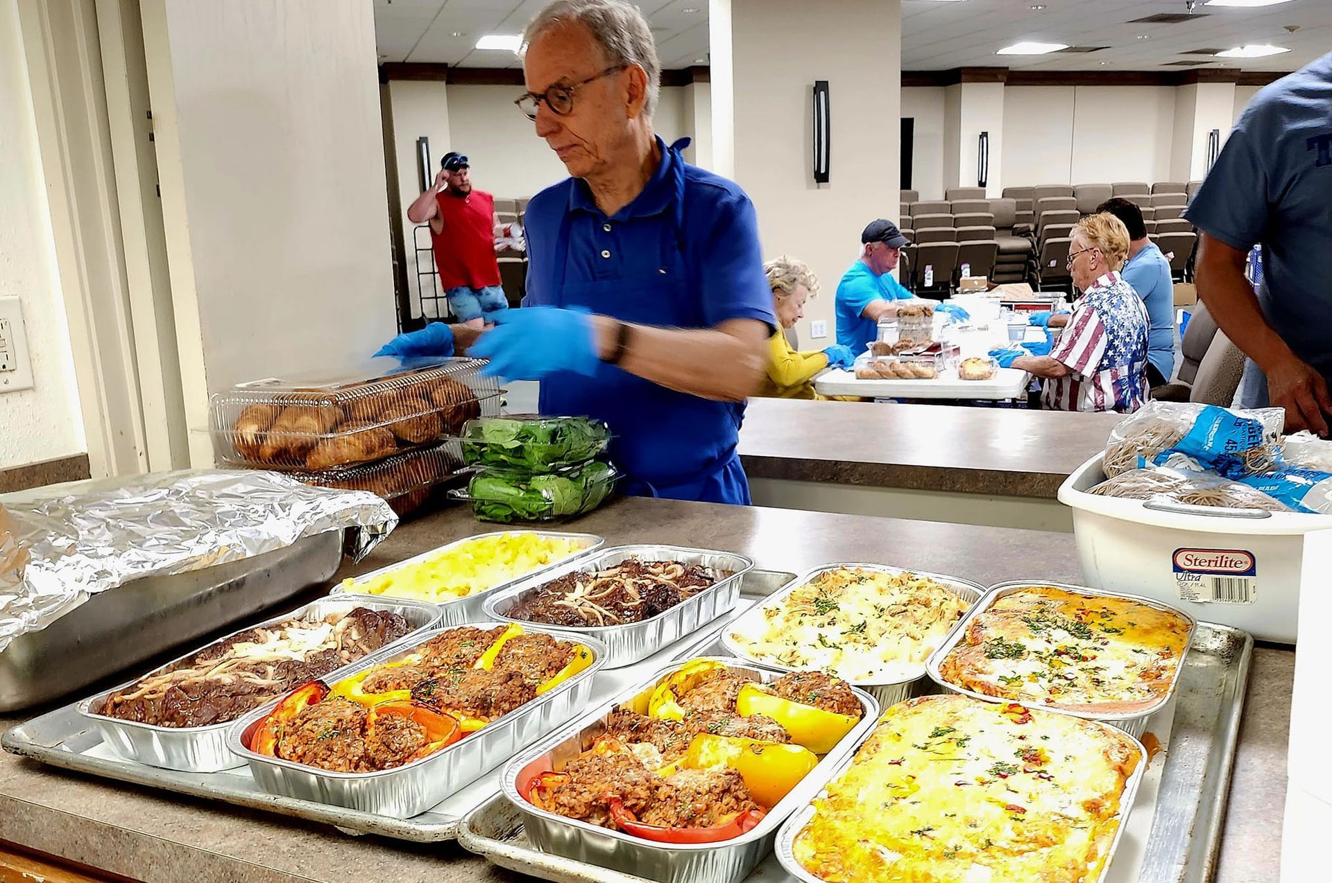 Volunteers making and packing meals for Taste of Hope