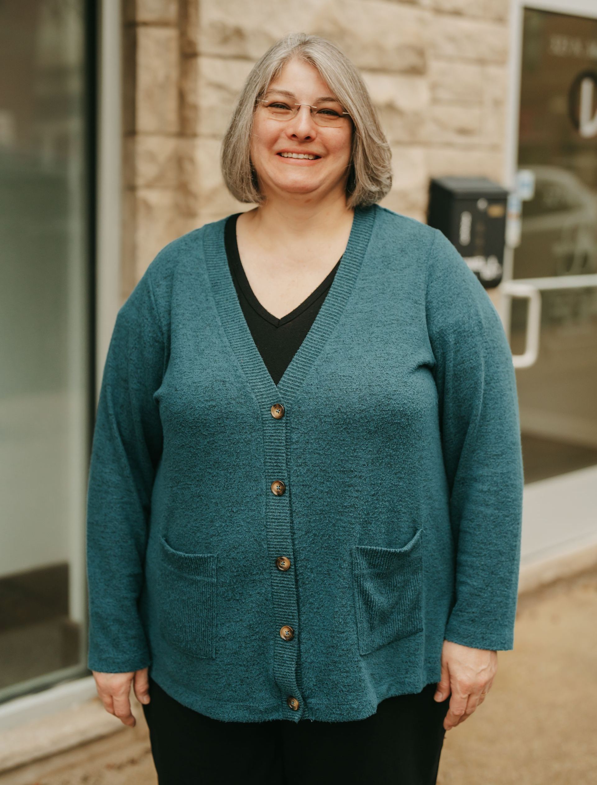 A man in a suit and tie without a face