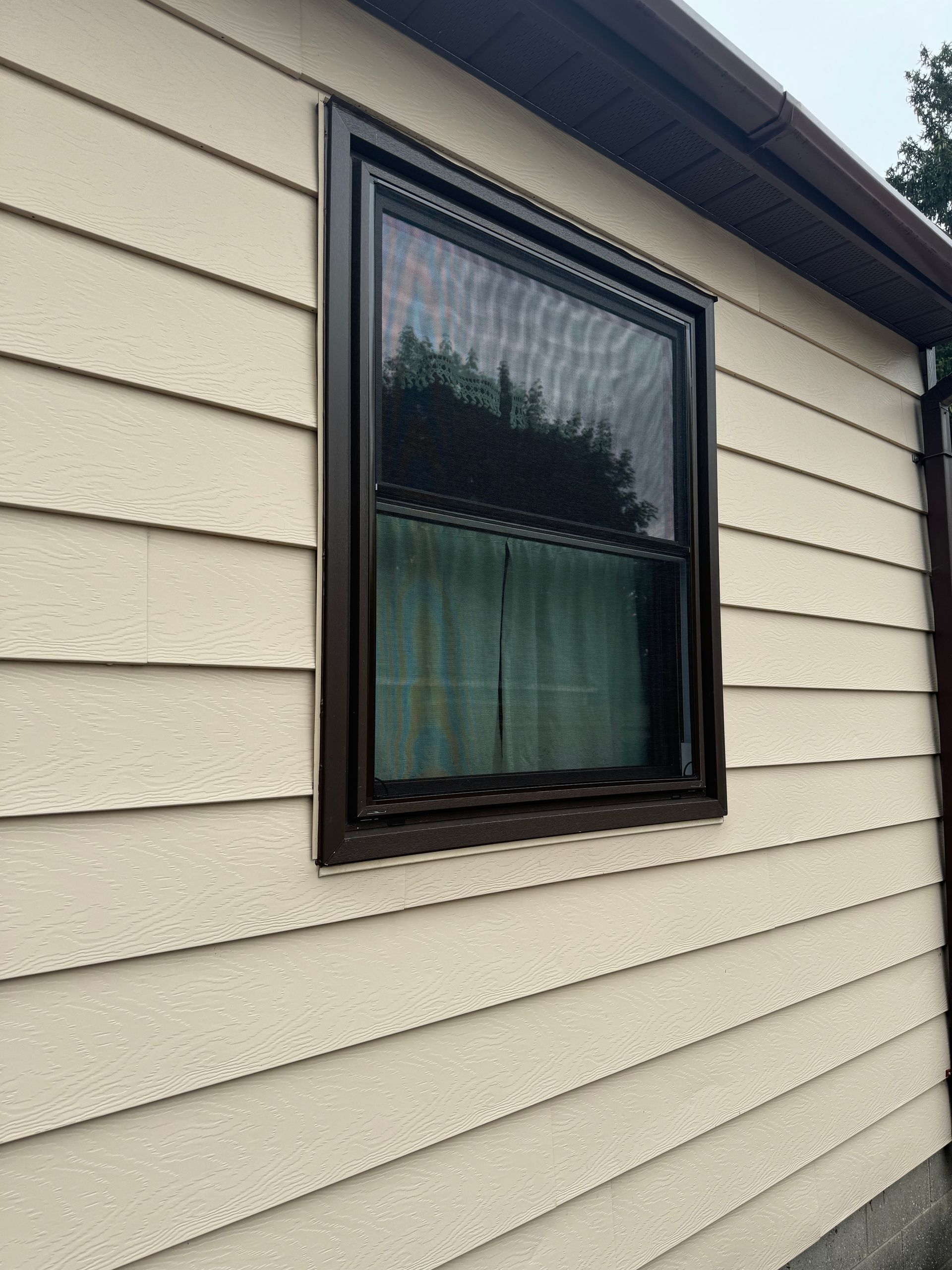 A house with a window on the side of it.