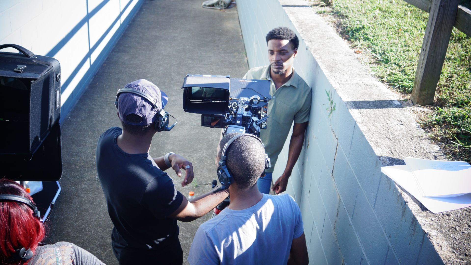 A man in a blue shirt with the letter v on it