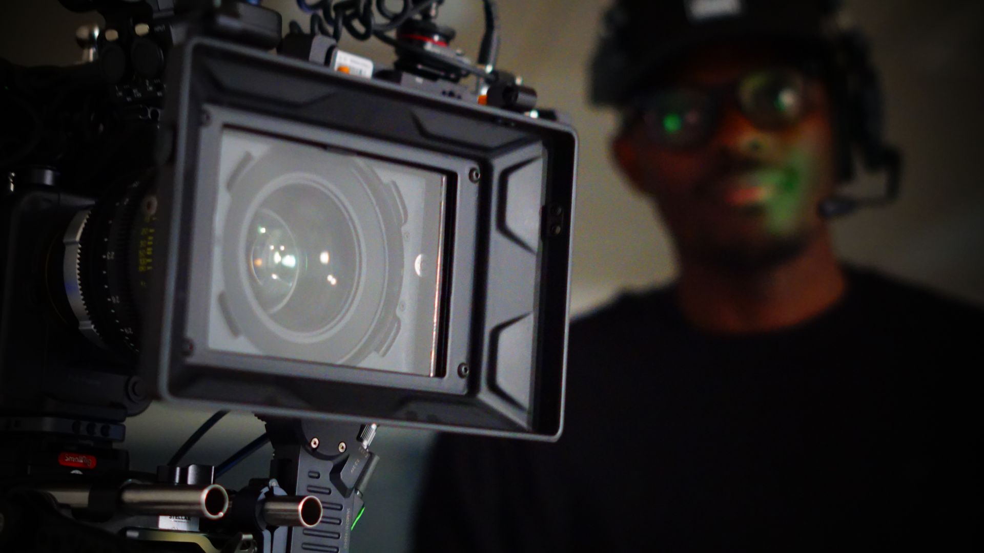 A man is standing in front of a camera.