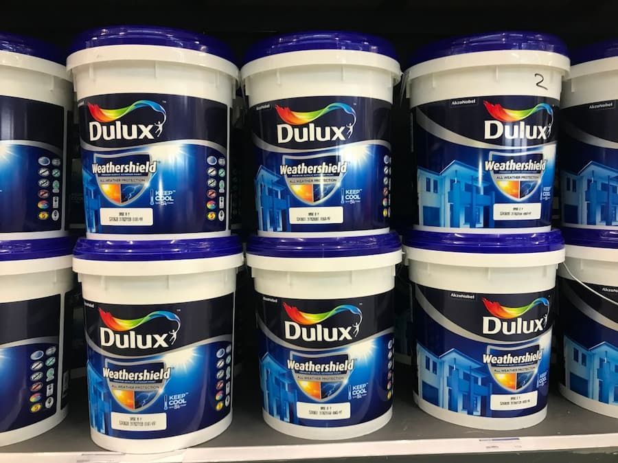 Dulux Commercial Paint Containers on Top of One Another — Painters in Mackay