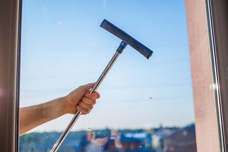 a person is holding a broom in their hand