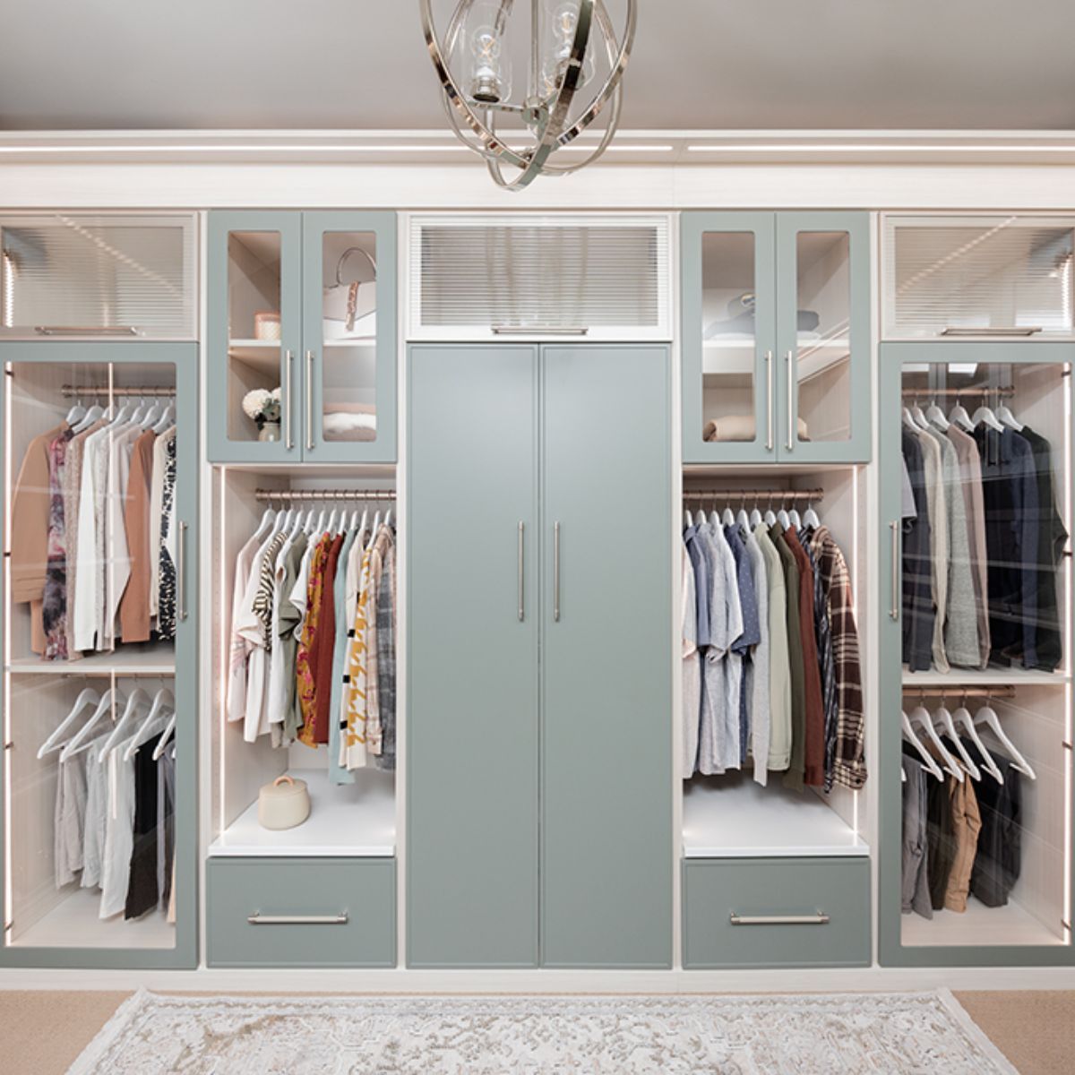 A large walk in closet filled with clothes and drawers
