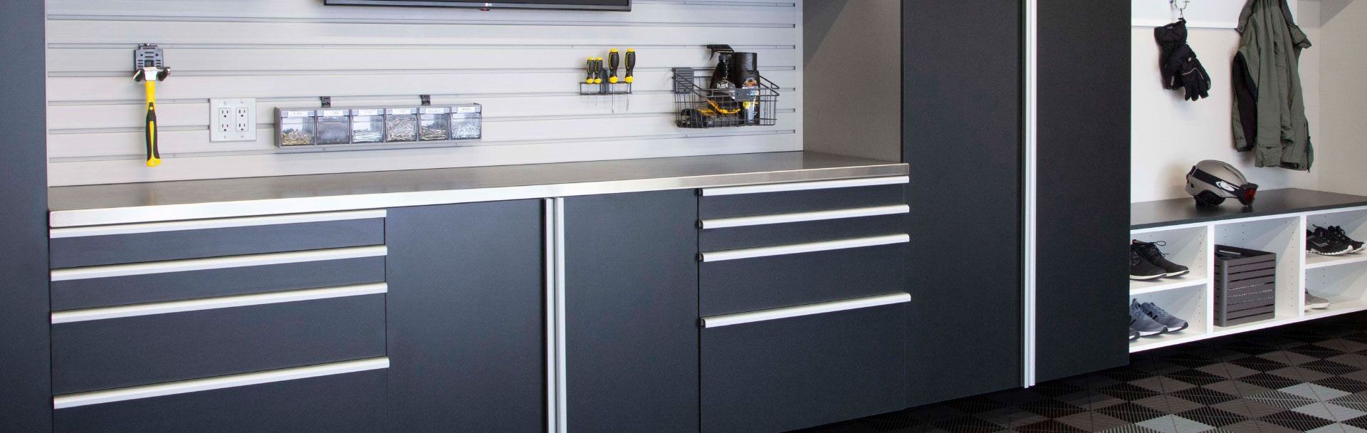 A garage with  a  grey cabinets 