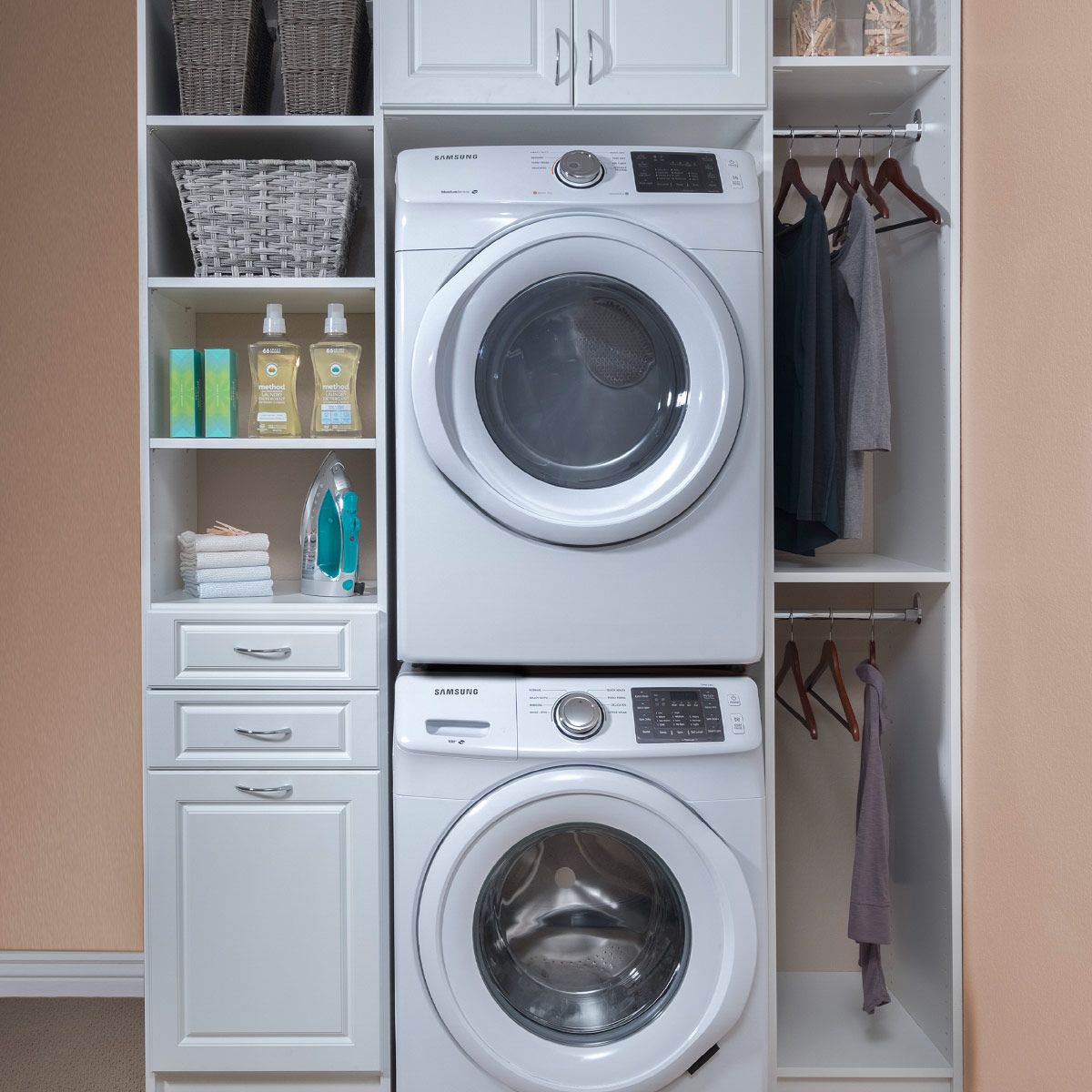 A washer and dryer are stacked on top of each other in a laundry room