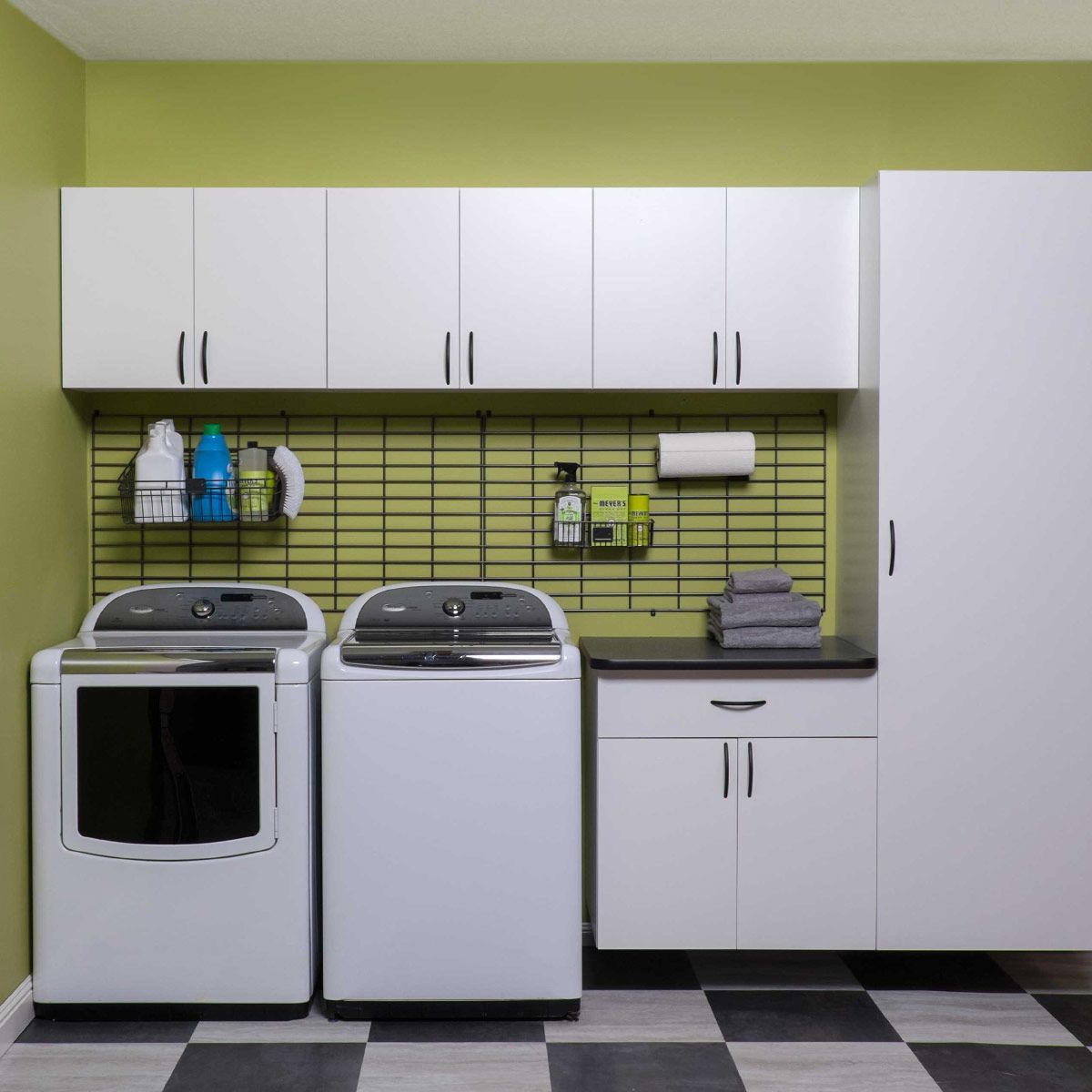 A laundry room with a washer and dryer in it