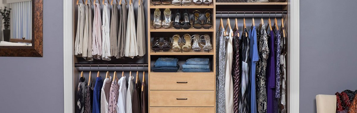 A closet filled with lots of clothes and shoes.