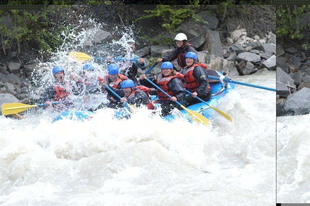 A group of people are rafting down a river.