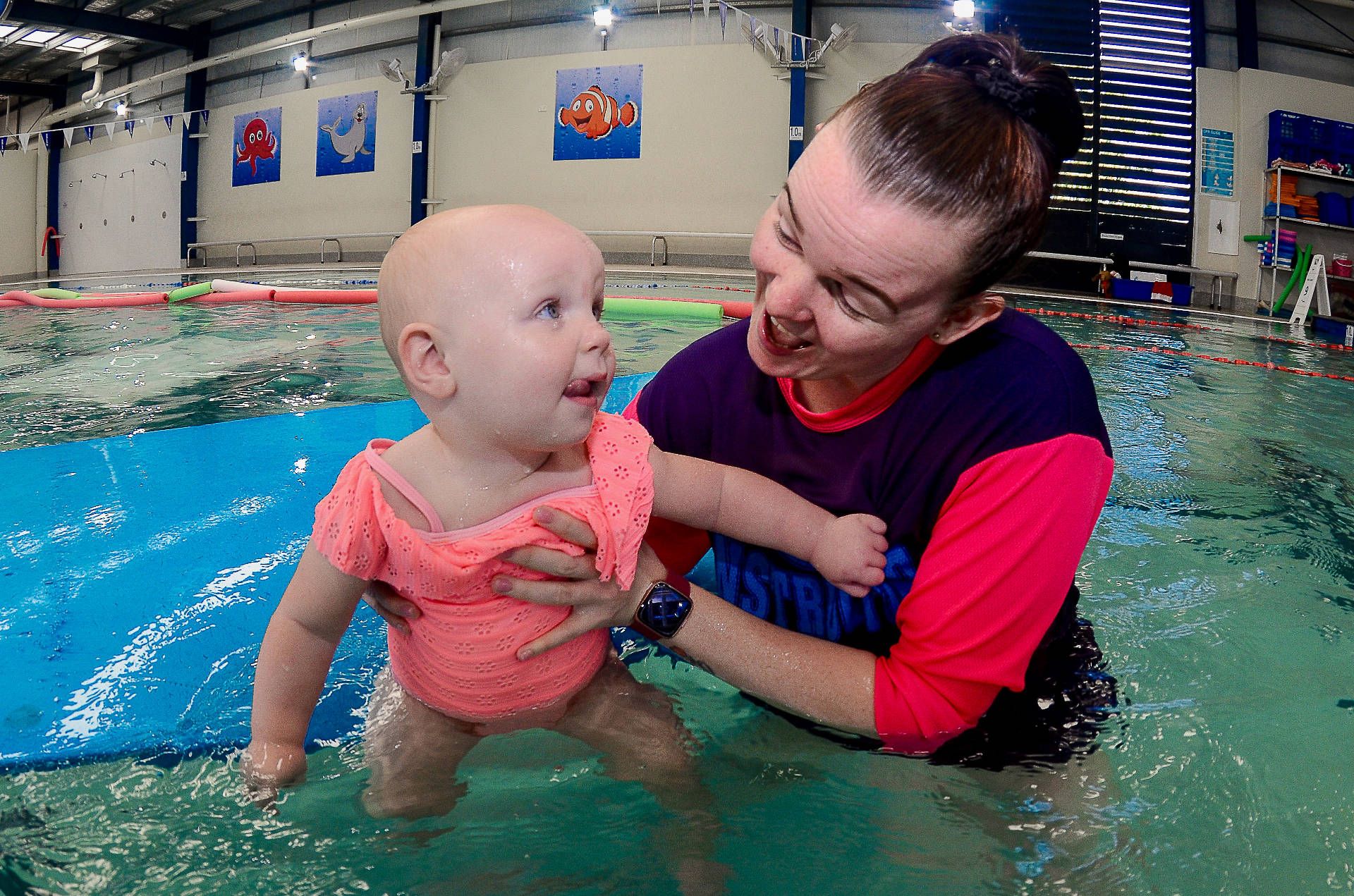 Swimming Instructor with child