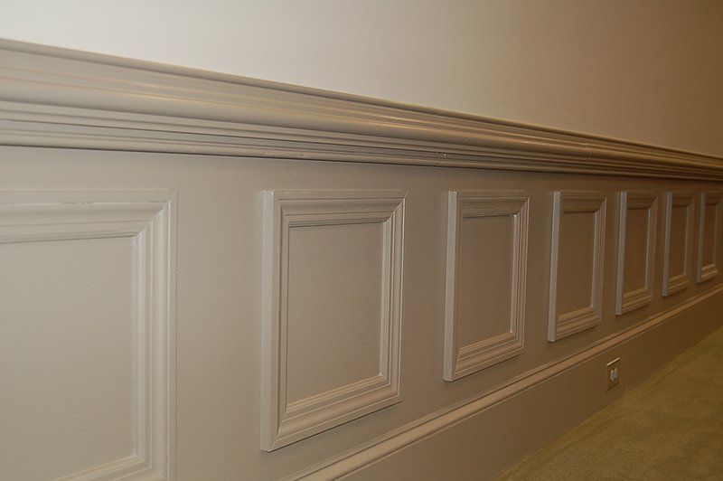 A wall with a row of squares on it.