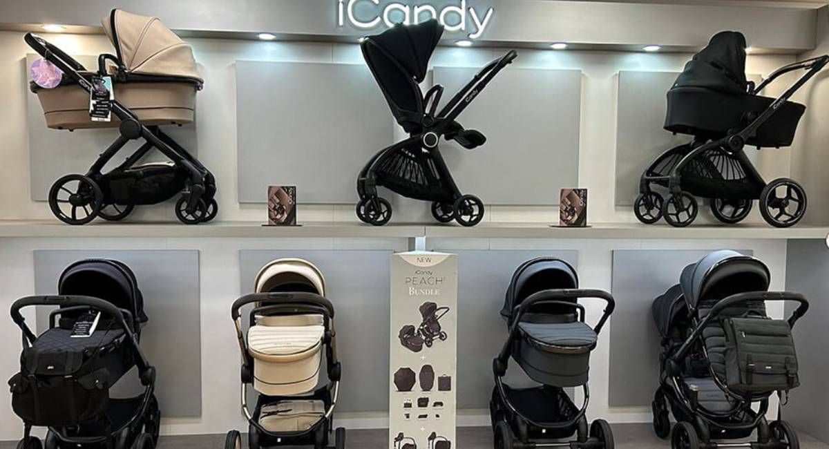 Showroom display of a range of prams for sale at Winstanleys Pramworld