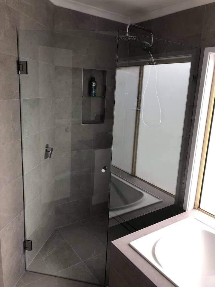 Glass Shower Enclosure With Gray Tiled Walls — JNR Building And Maintenance in Green Hill, QLD