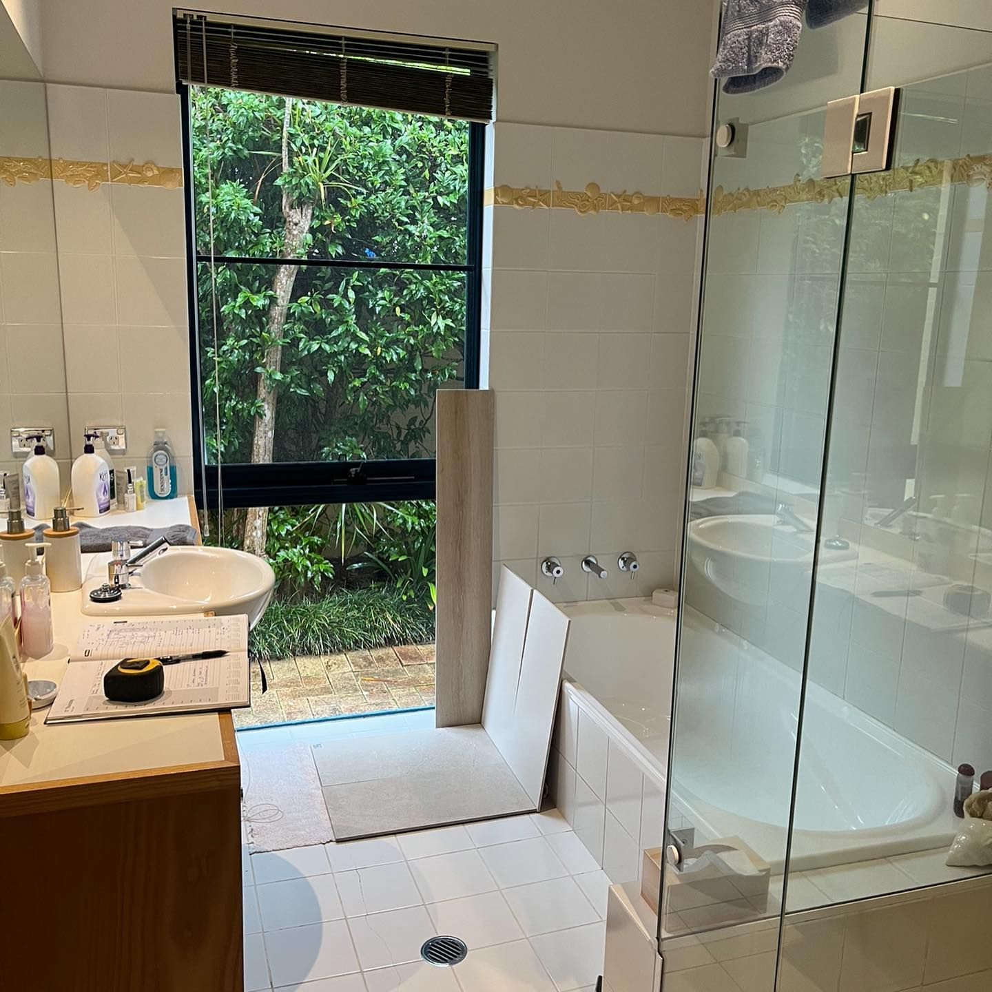 Bathroom With a Window, Sink, Tub, and Shower — JNR Building And Maintenance in Green Hill, QLD