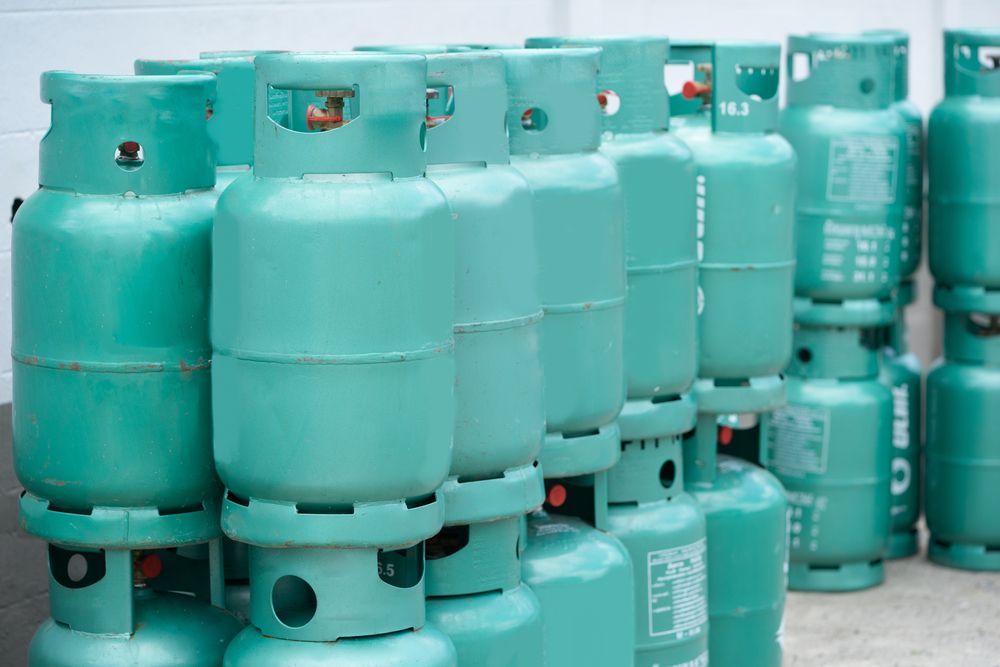 A Row of Green Gas Cylinders Stacked on Top of Each Other — Bundy Ice in Bundaberg East, QLD
