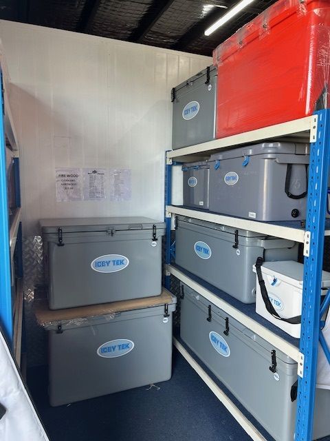 A Bunch of Coolers Are Stacked on Top of Each Other — Bundy Ice in Gladstone, QLD
