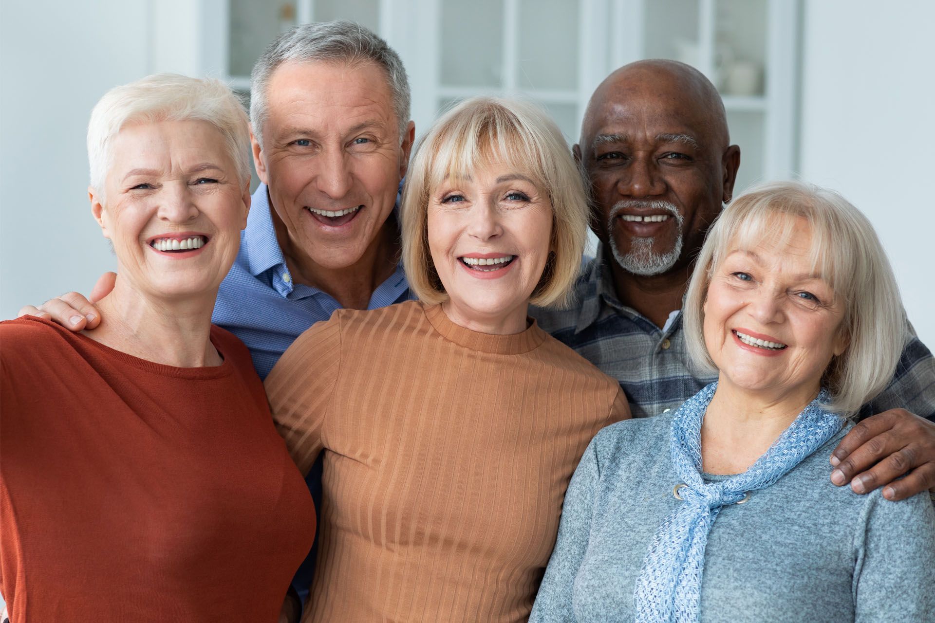 group of elderly people together and smiling