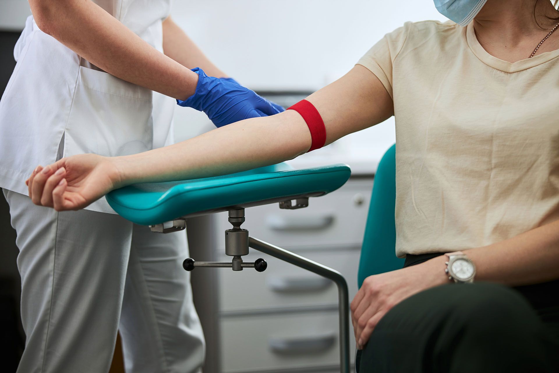 a nurse preparing to get blood from a patient