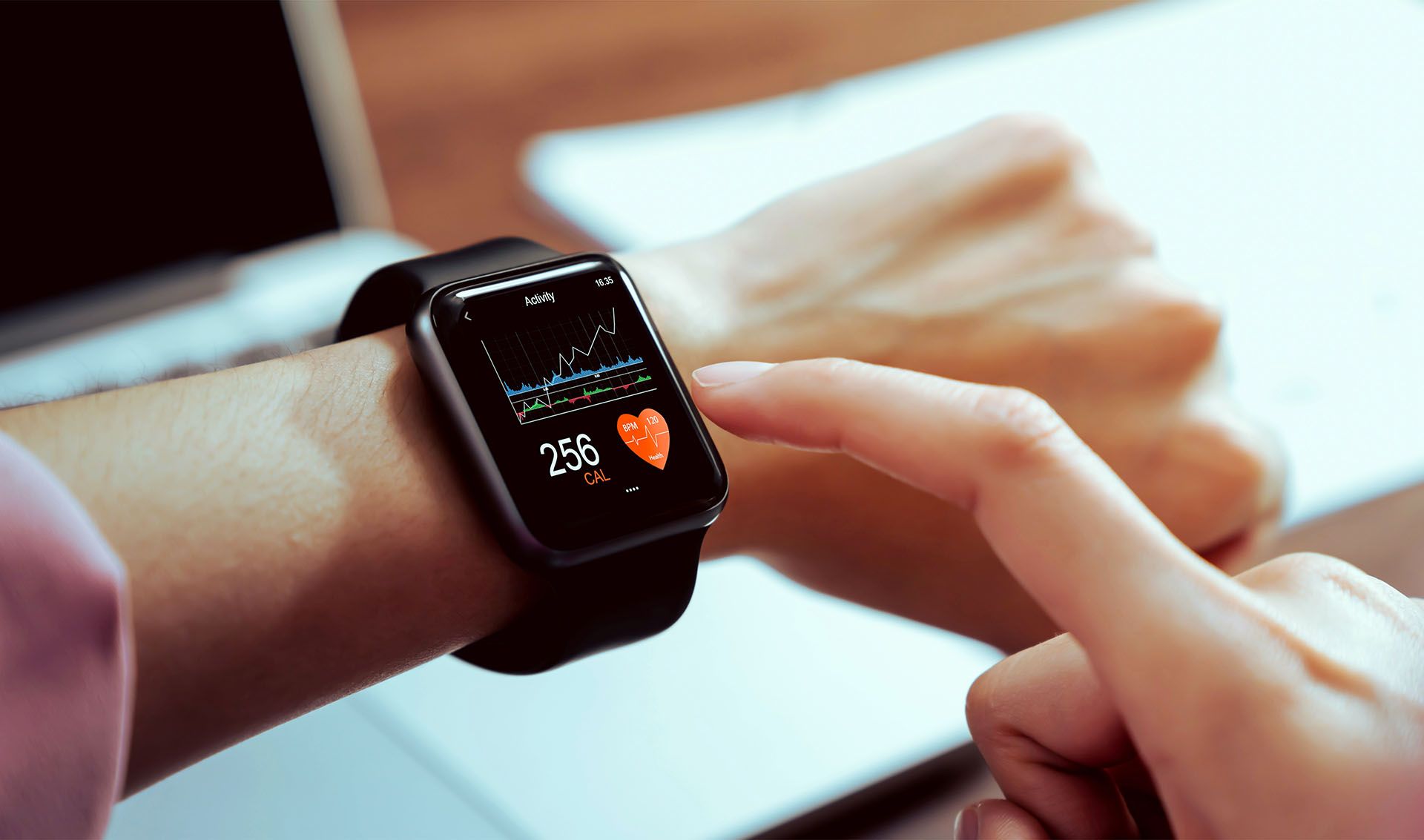 A person is wearing a smart watch on their wrist.