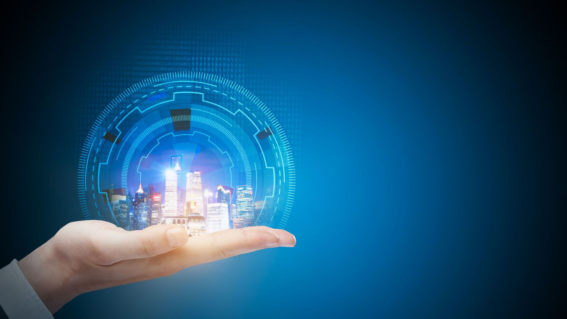 Hand holding a glowing sphere with a city inside, surrounded by a circuit board design, on a blue background.